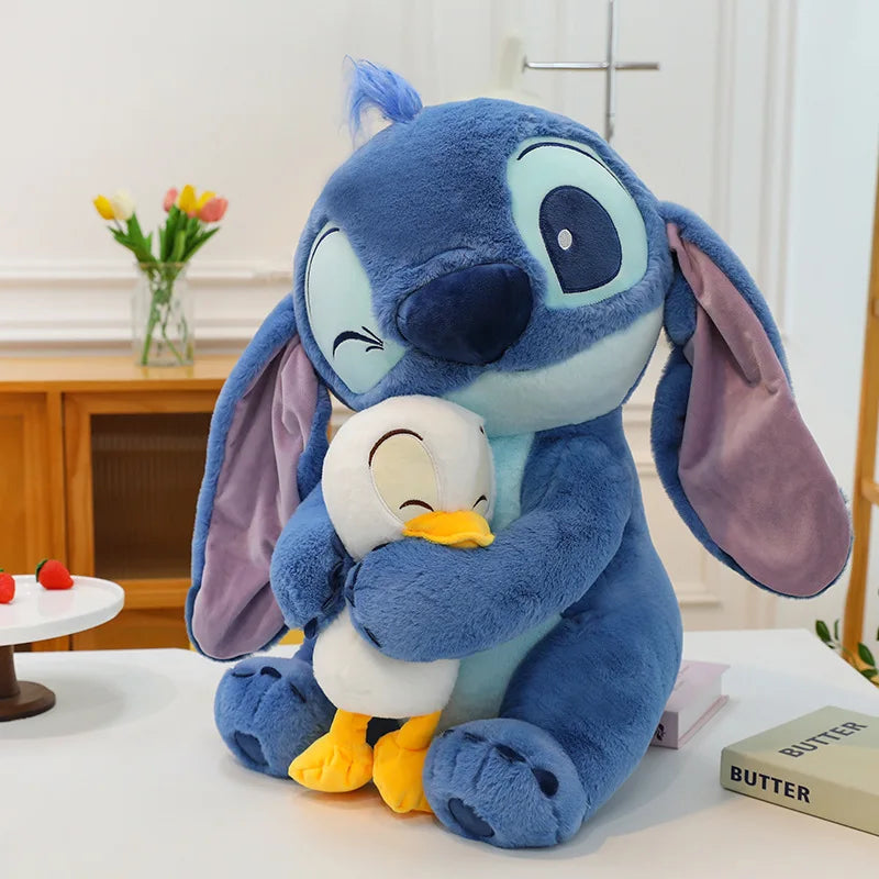 Stitch Plush Holding Duck on a table